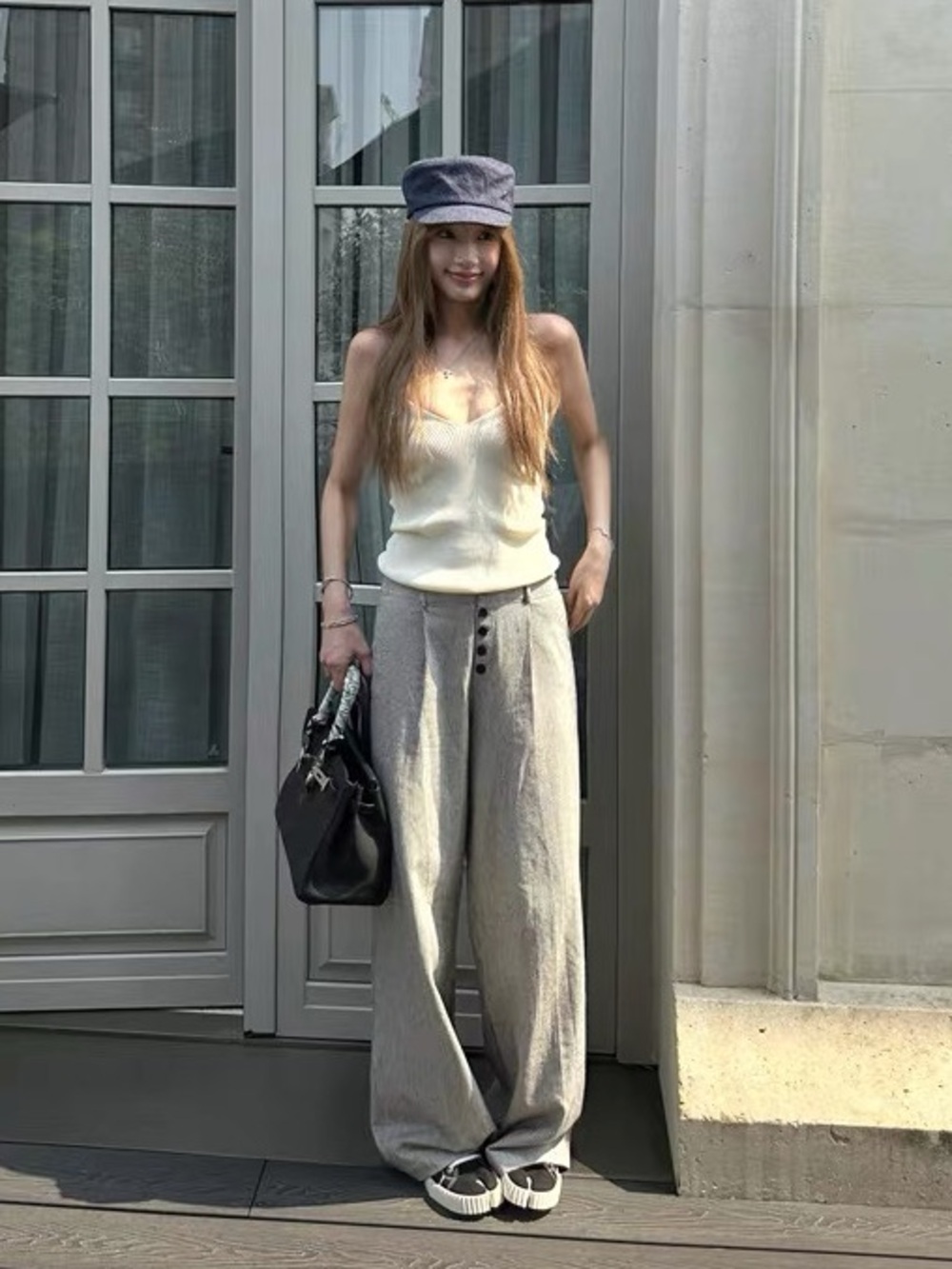 white and black vertical striped pants with button detail